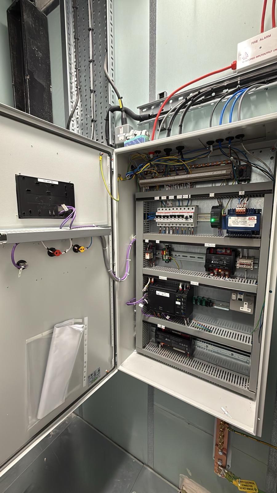 Newly installed BMS panel with fire alarm interface and site cabling